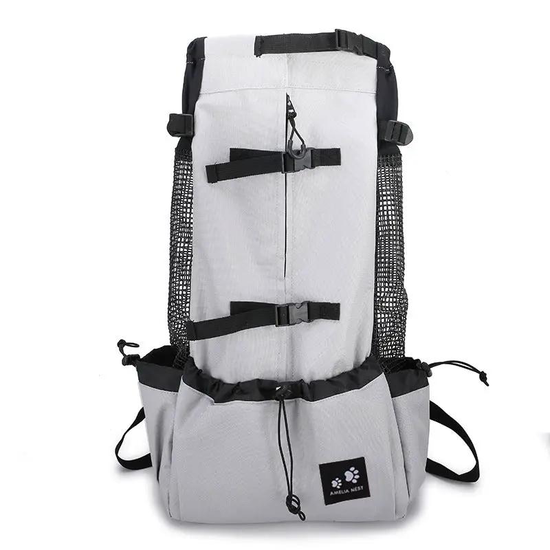 Dog carrier backpack in gray with black straps, side mesh pockets, travel-ready pet carrier bag