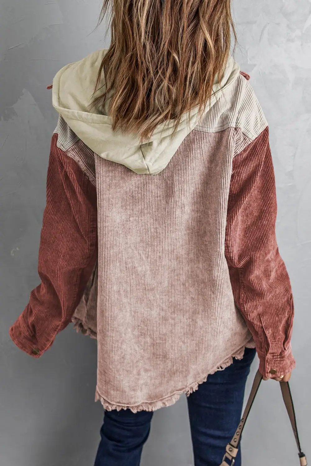 Snap Front Hooded Corduroy Shacket with pink body and rust sleeves.