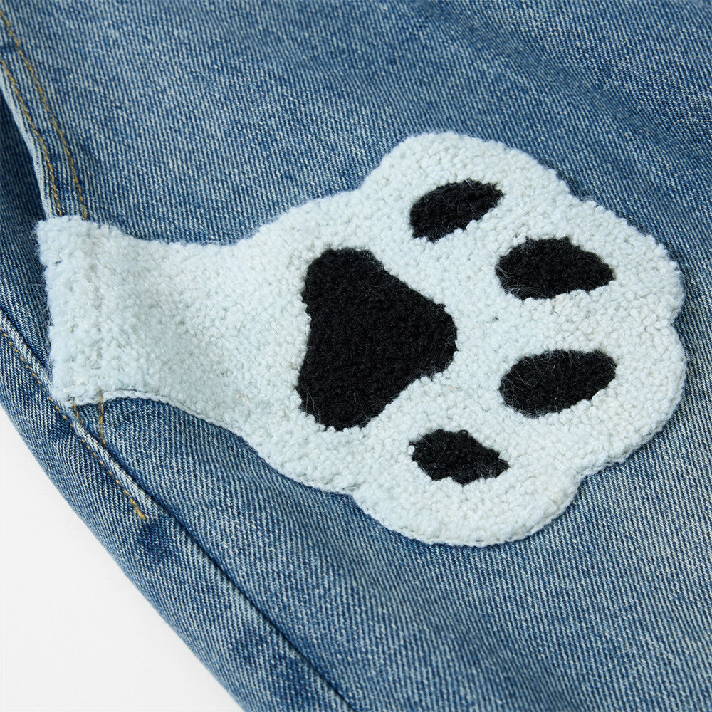 Embroidered denim workwear pants, blue denim with a white paw patch, by eprolo.