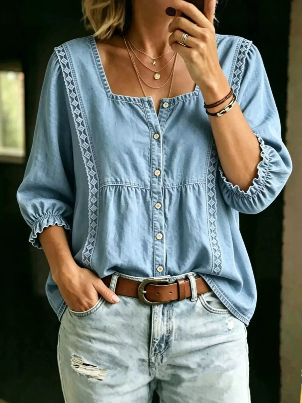 Plus size square-neck button-down denim shirt with front ruffle trim and puff sleeves, light wash.