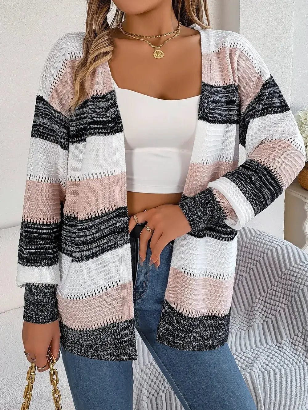 Openwork striped open-front lightweight cardigan in white, blush pink, gray, and black; relaxed fit.