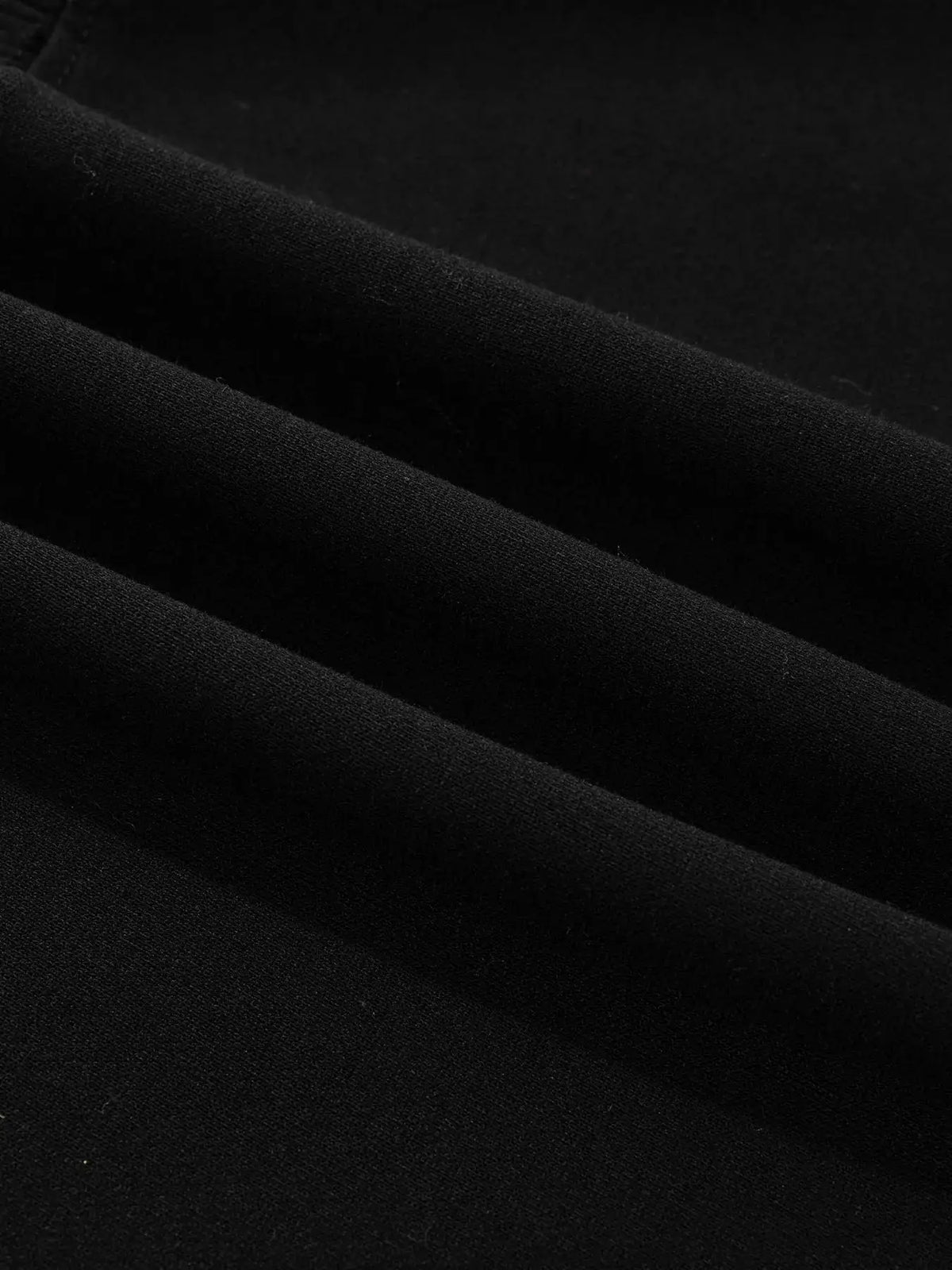 Trendsi Embroidered Spooky Season long sleeve round-neck sweatshirt in black; close-up fabric texture.