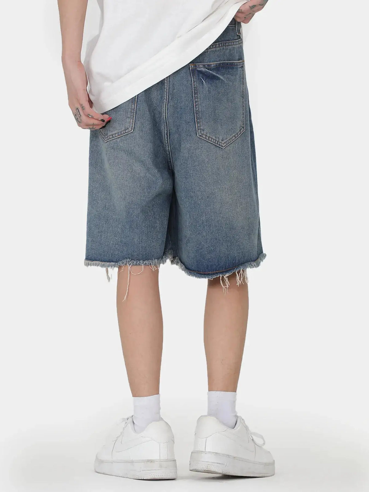 Mens oversized distressed denim shorts with stretch cotton pockets, blue denim, back pockets, frayed hems