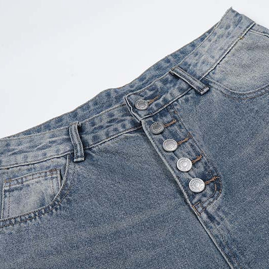 Single row button denim shorts in blue denim with five-button fly and belt loops.