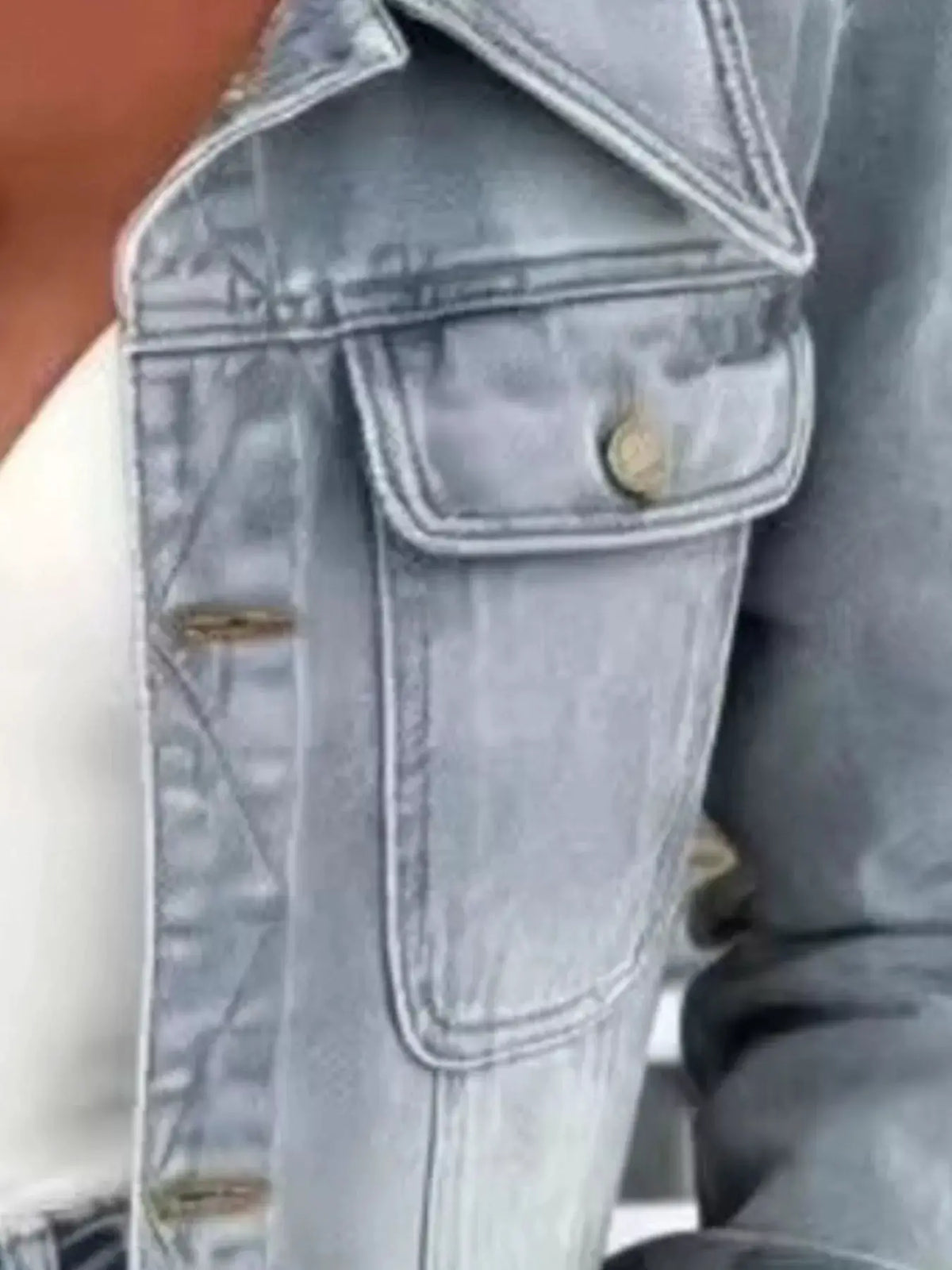 Plus size cropped denim jacket by Trendsi, light-blue cotton blend with chest pocket and slim fit.