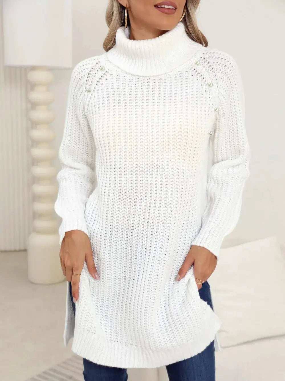 Womens white turtleneck knit pullover sweater with side slits and shoulder button accents