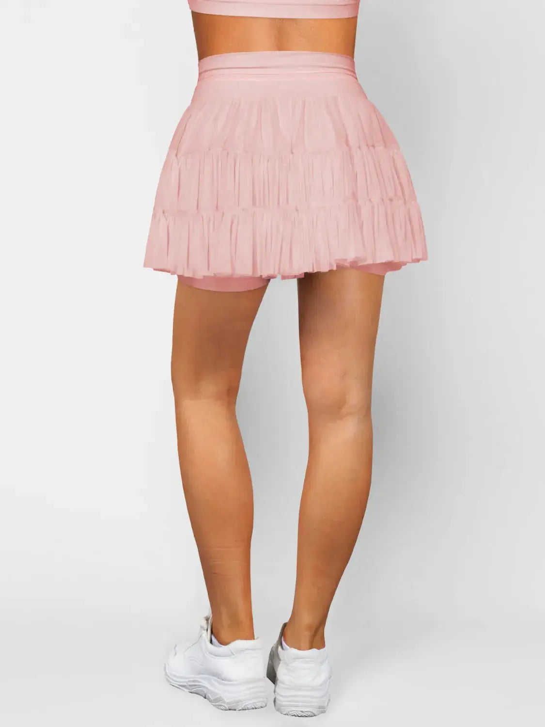 Ruched pink mini skort with pockets, tiered ruffle detail and built-in shorts
