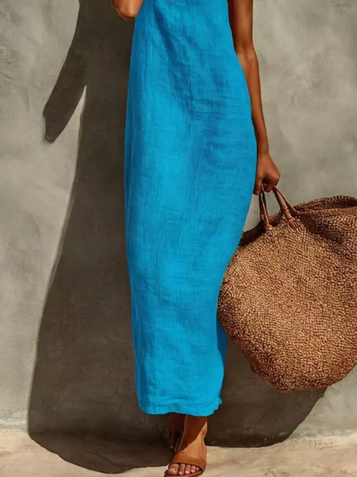 Sleeveless linen maxi dress in turquoise with a woven tote bag