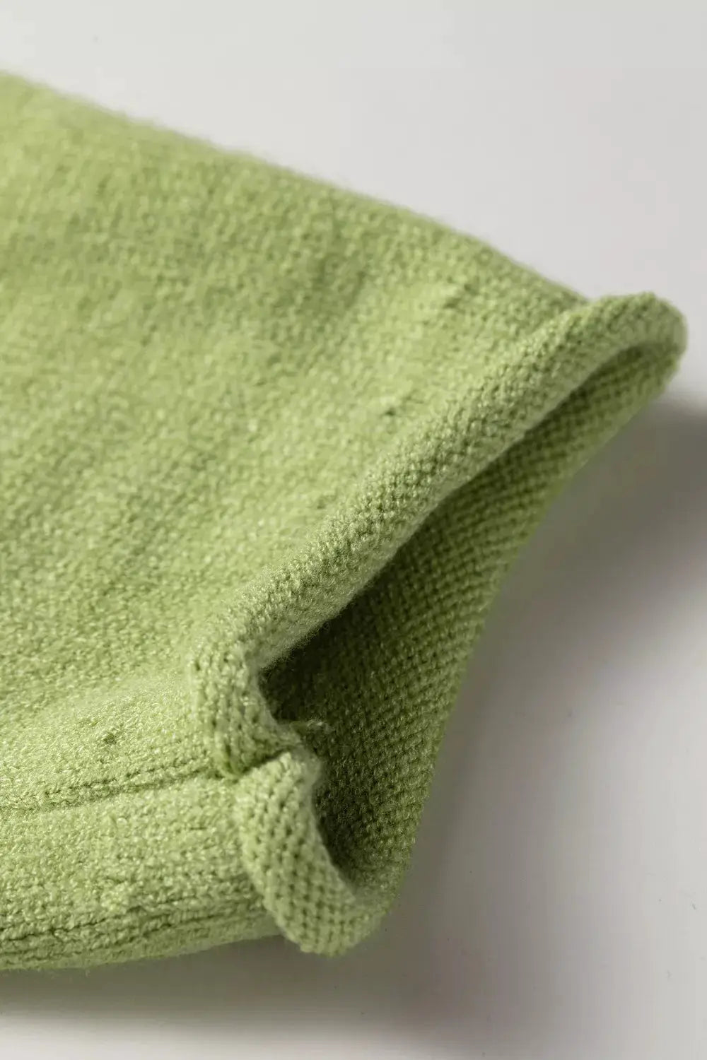 Fish graphic round-neck sweater in light green knit fabric