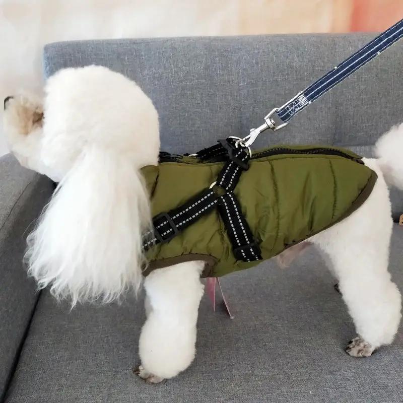 Waterproof dog coat with harness by AdTec in olive green, shown on white fluffy dog.