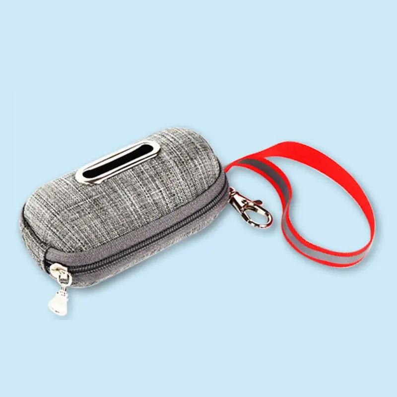 AdTec portable dog poop bag dispenser in gray fabric with red strap and metal clip