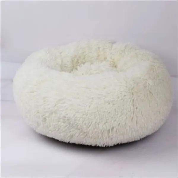 Round cream plush cat nest bed with long fluffy fur.