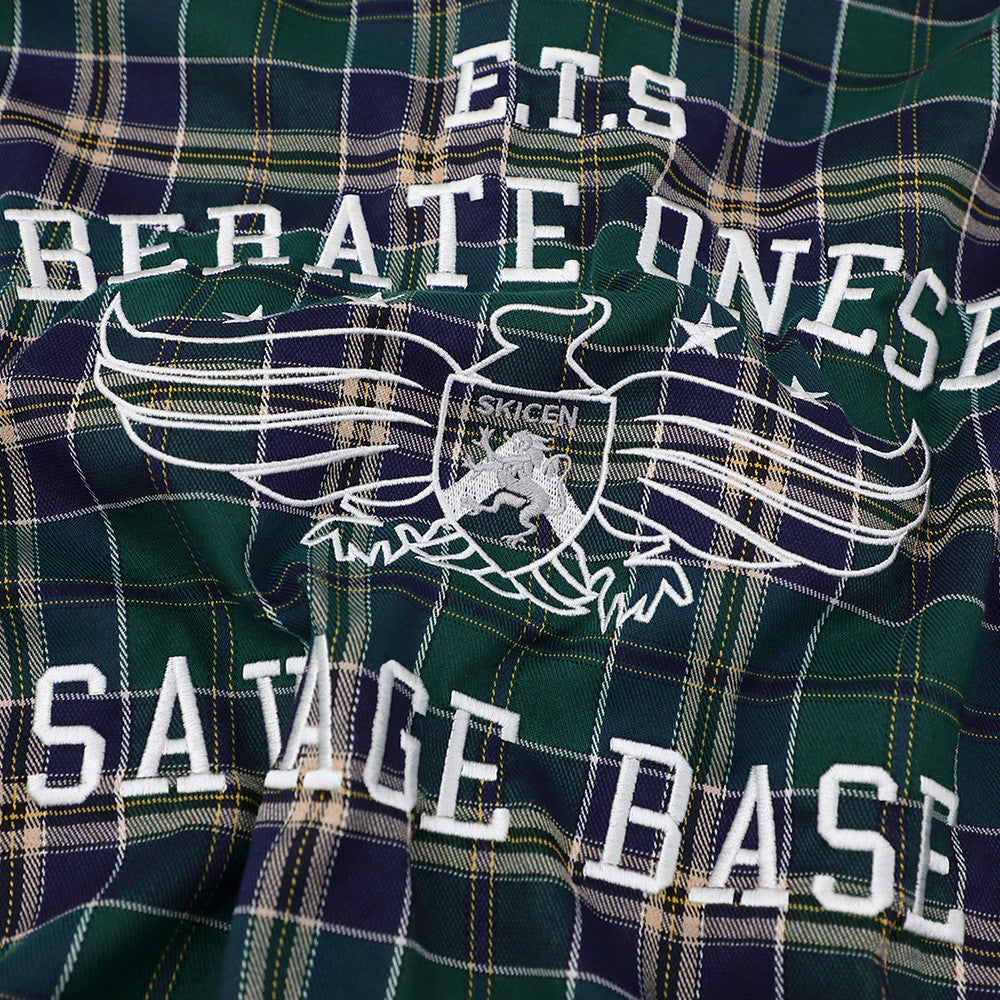 Loose plaid short-sleeve shirt in green and navy with white embroidered crest design