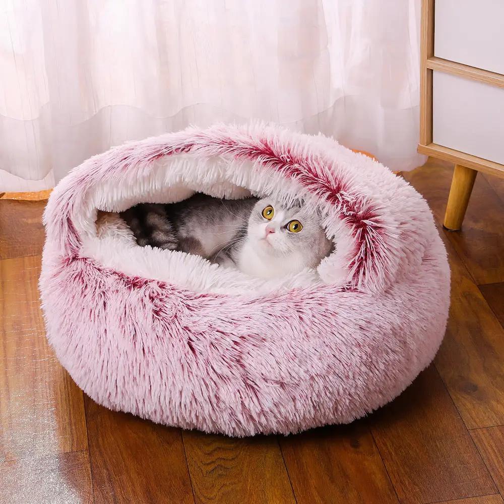 AdTec pink plush donut pet bed with a cat inside; cozy semi-enclosed design