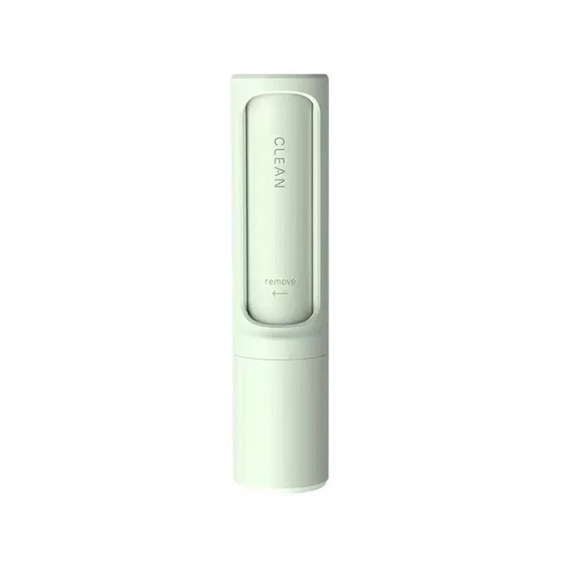 Portable 2-in-1 reusable pet hair remover brush, self-cleaning lint tool in white with light green accents