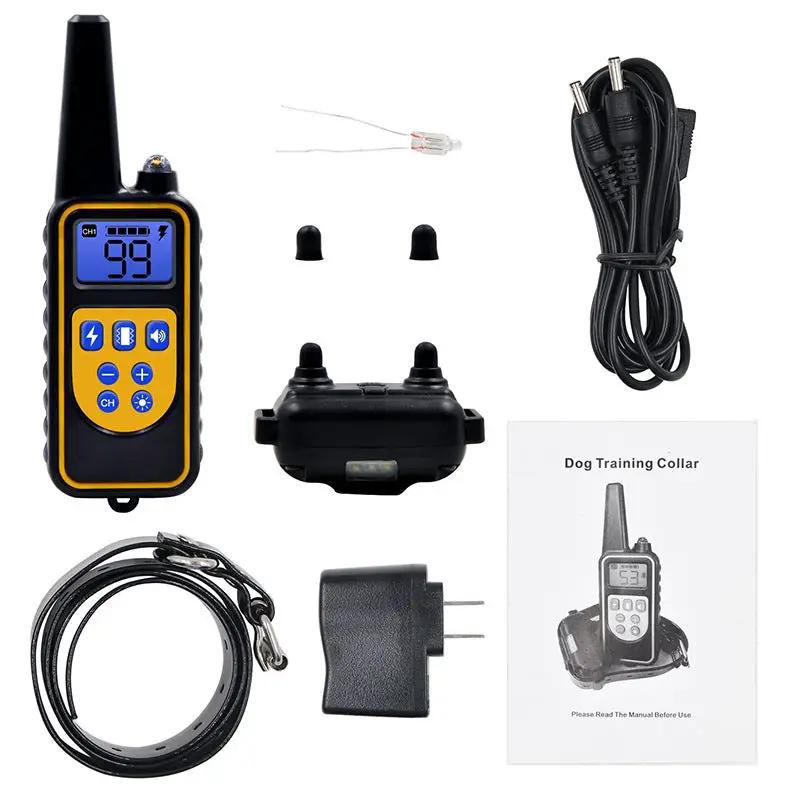 AdTec remote dog training collar kit with handheld transmitter, black receiver, charging cable, and manual.