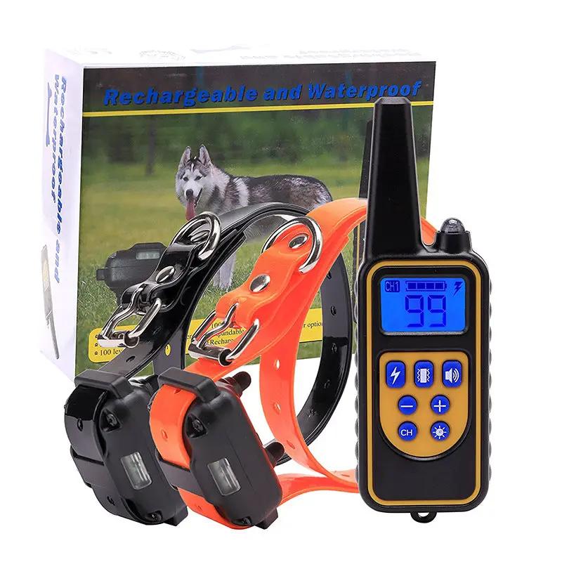 AdTec remote control dog training collar kit with two rechargeable orange and black collars and a blue-display handheld transmitter.