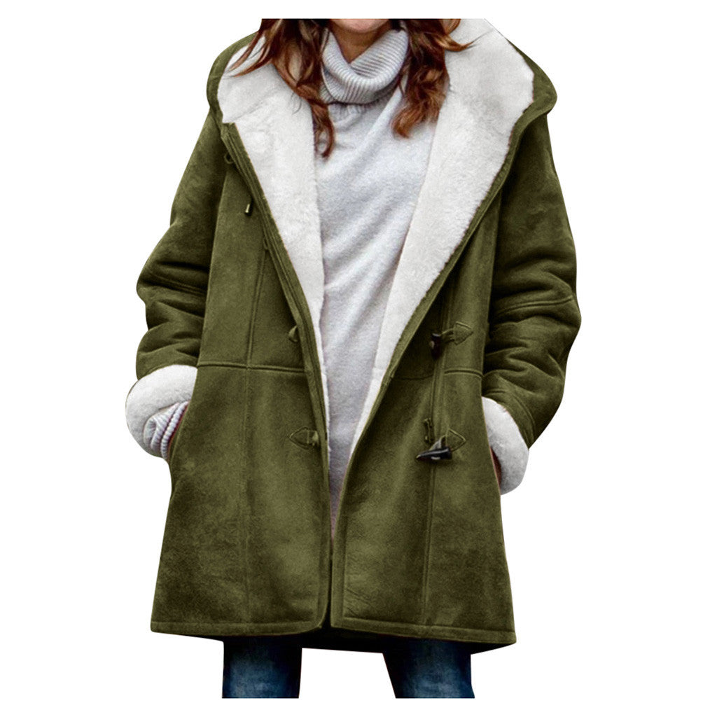 Women's vintage winter coat by AdTec; olive green overcoat with white shearling lining and toggle closures.