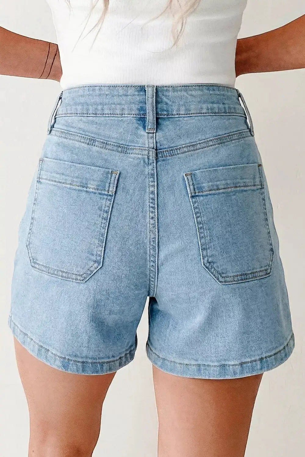 High rise patch-pocket denim shorts in light wash blue with two back pockets