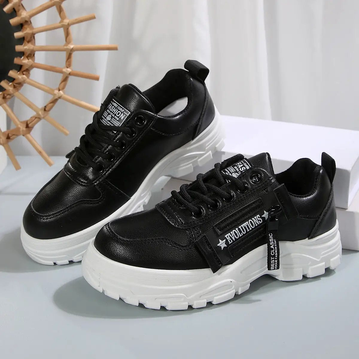 AdTec lace-up sports shoes with side-zip, black synthetic uppers and chunky white soles for women (2 shoes).
