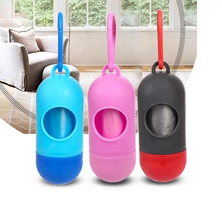 Pet poop bag dispensers by AdTec in blue, pink, and gray with red bases (3-pack)