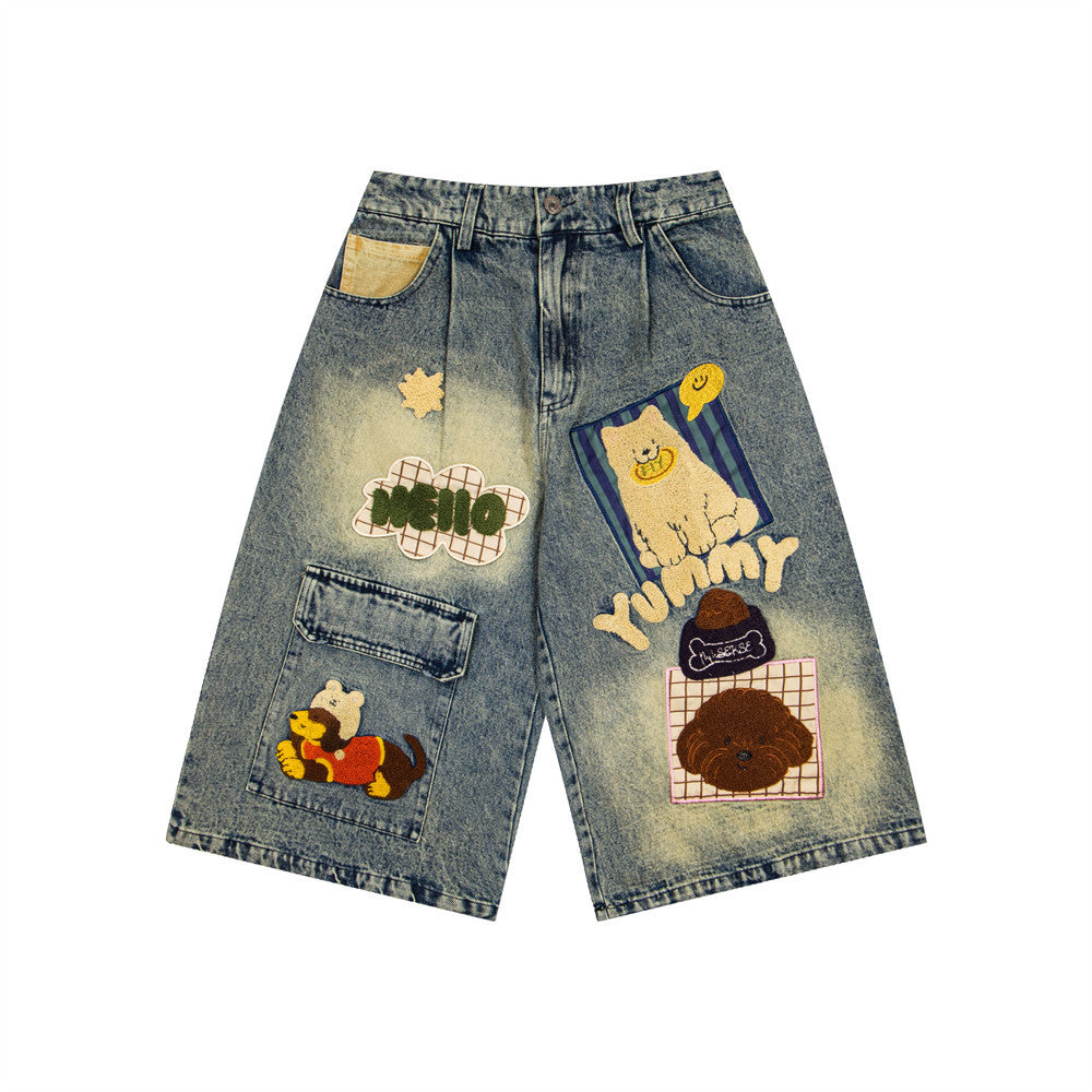 Denim shorts with colorful patches on a distressed, faded wash