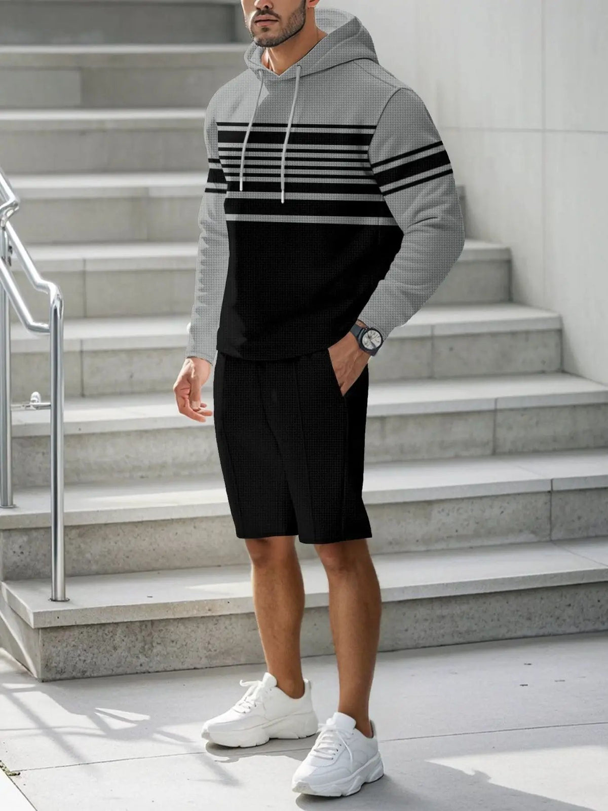 Men's striped hoodie and shorts two-piece loungewear set by Trendsi; gray hoodie with black stripes.