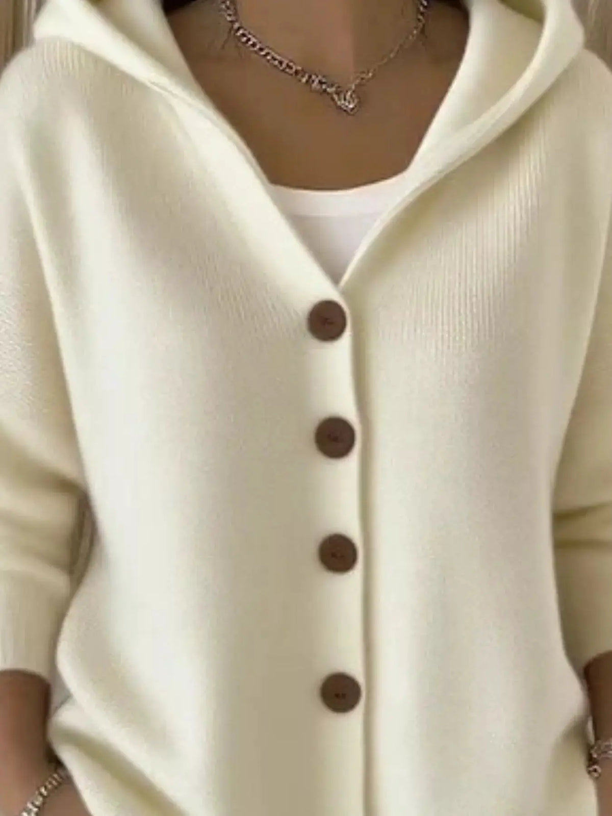 Plus-size hooded button-front soft knit cardigan in cream with brown buttons by Trendsi