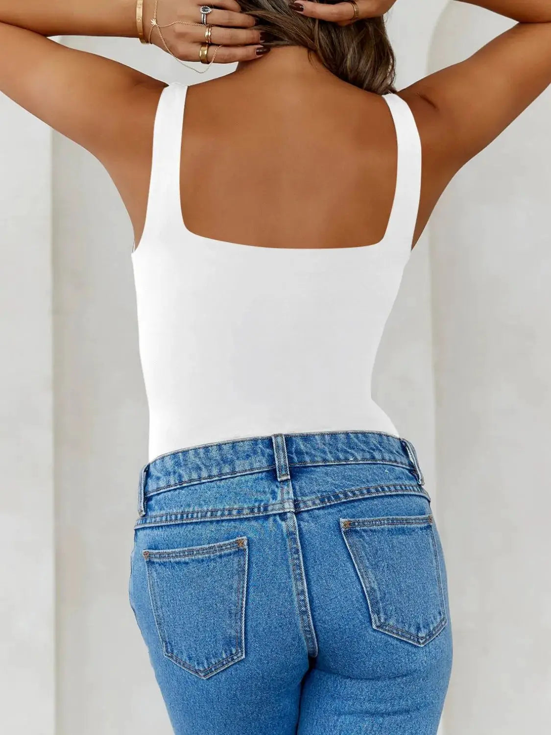 Solid Color Wide Strap Cami in white; square-back tank paired with blue denim jeans