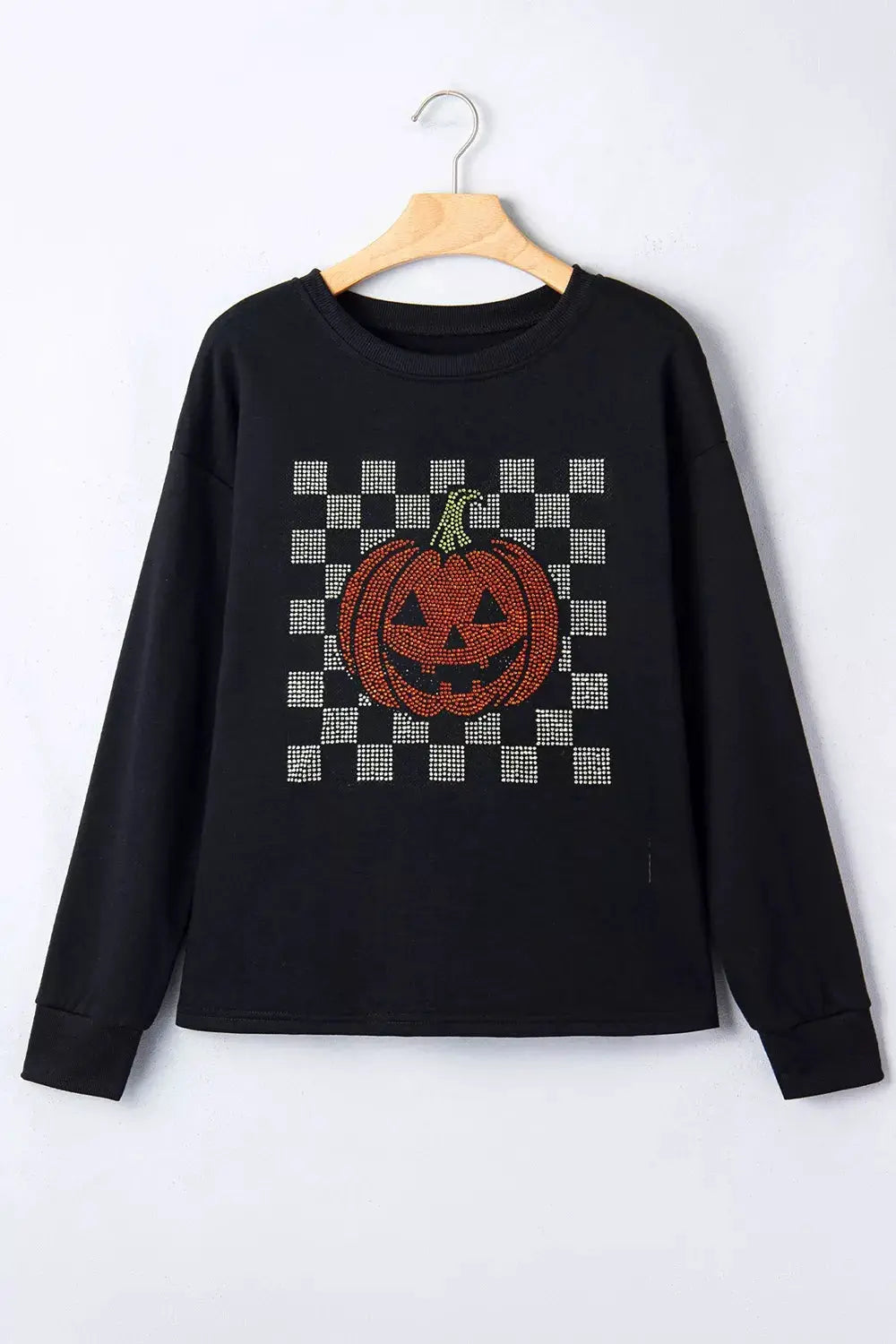 Rhinestone pumpkin long sleeve sweatshirt in black with a jack-o'-lantern design on front.