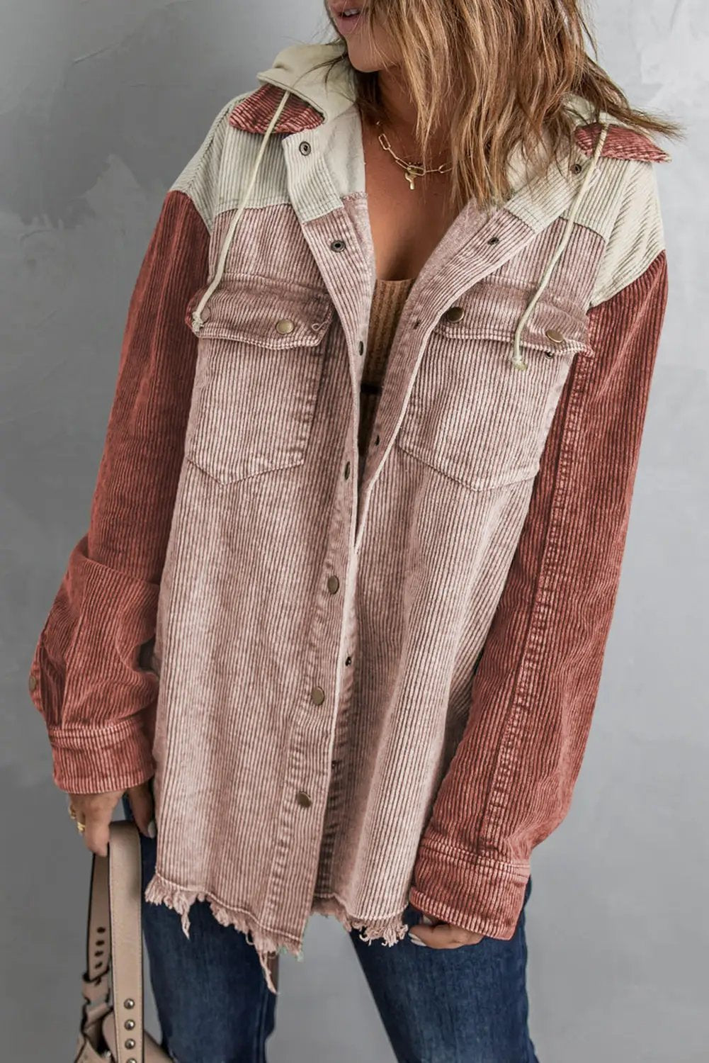Snap Front Hooded Corduroy Shacket in pink-rose with cream yoke, rust sleeves, and frayed hem