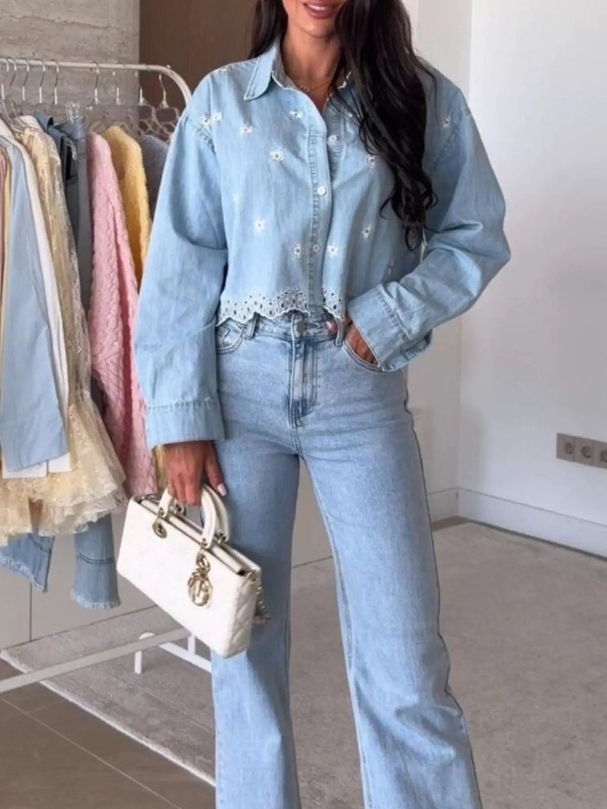 Embroidered cropped denim shirt by Trendsi, light blue with delicate floral eyelet detailing.
