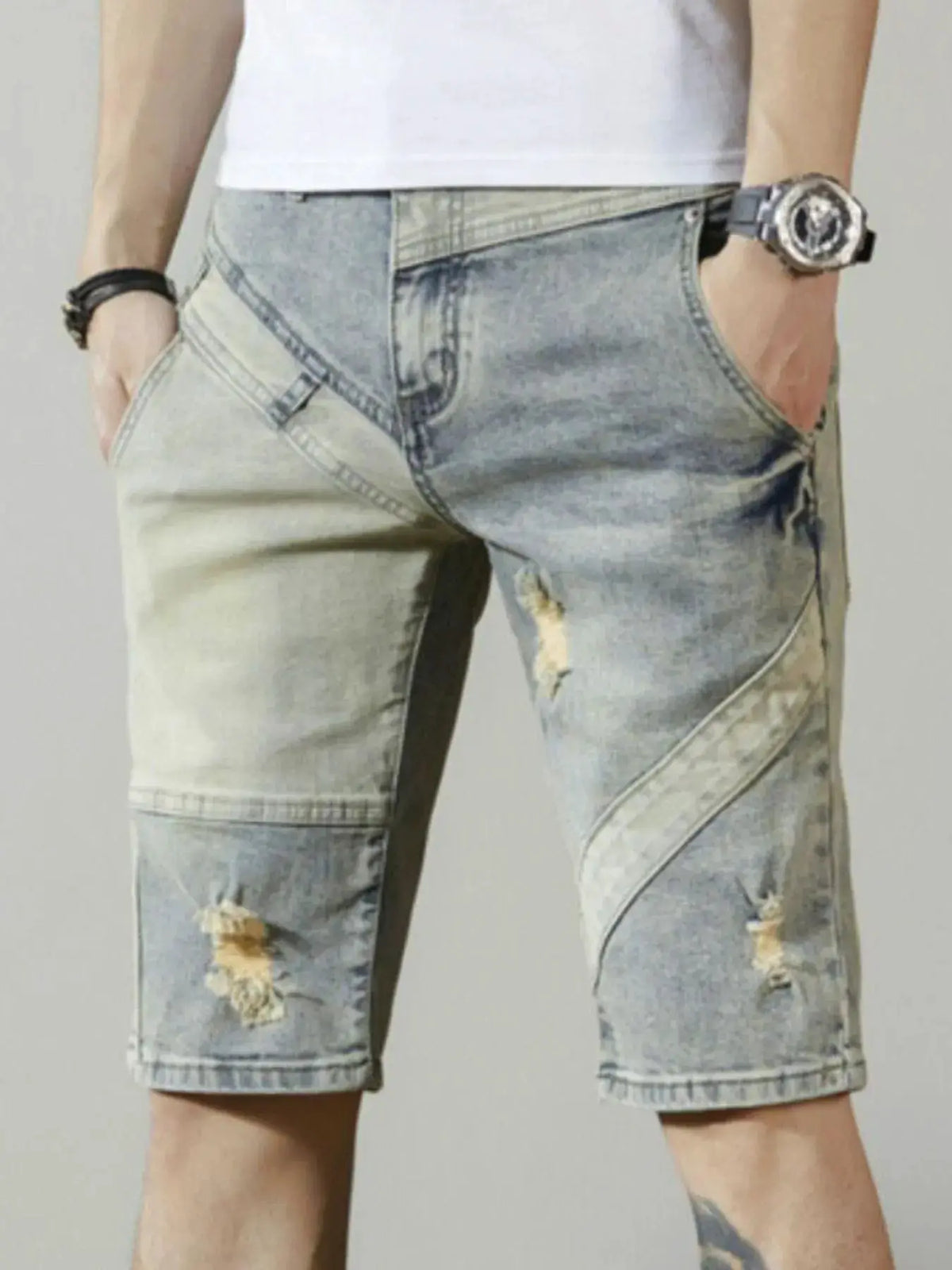 Men's relaxed stretch cotton denim shorts in light-wash with distressed details