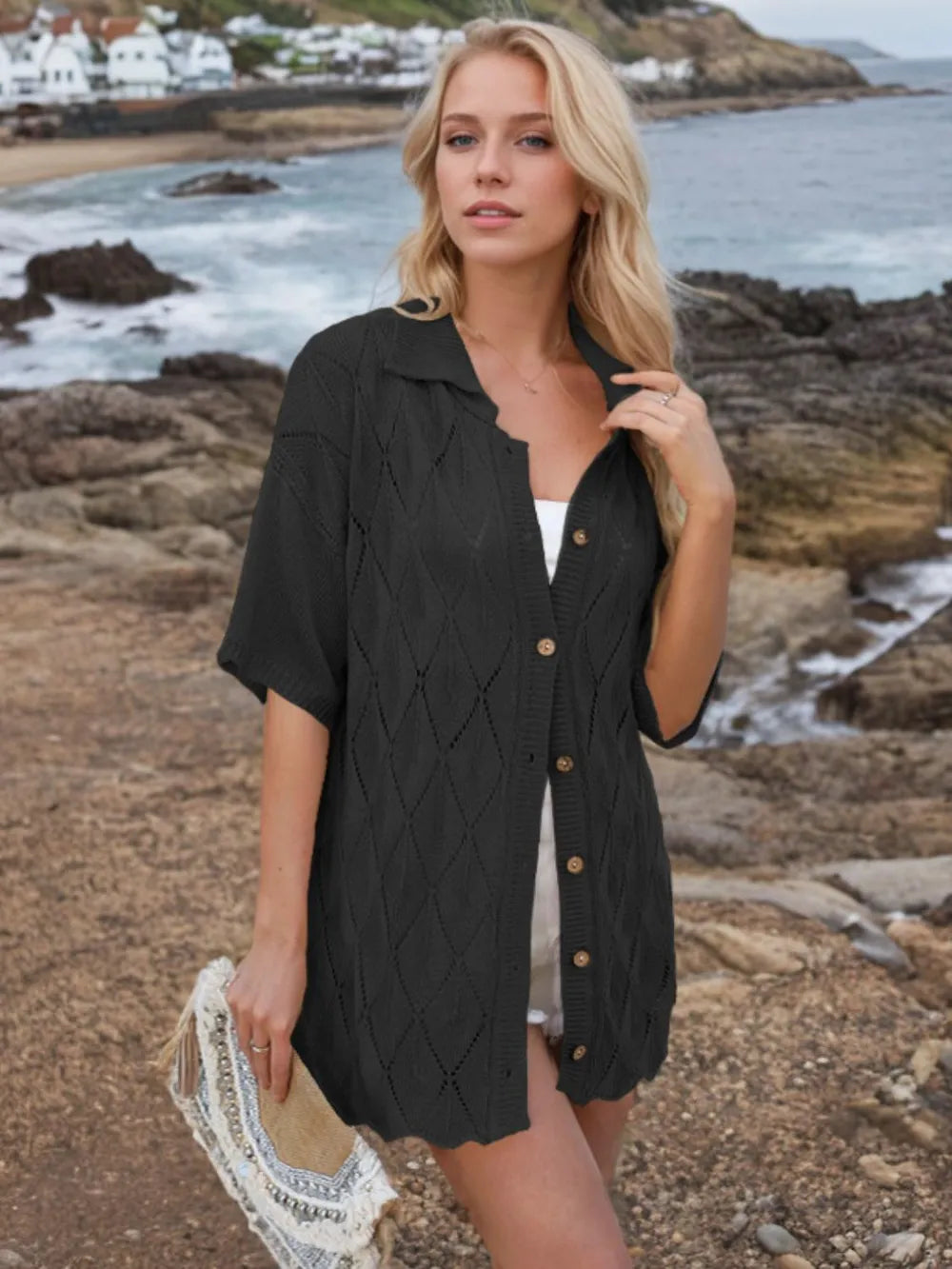 Womens button-down eyelet knit shirt in black with collared neck and wooden buttons