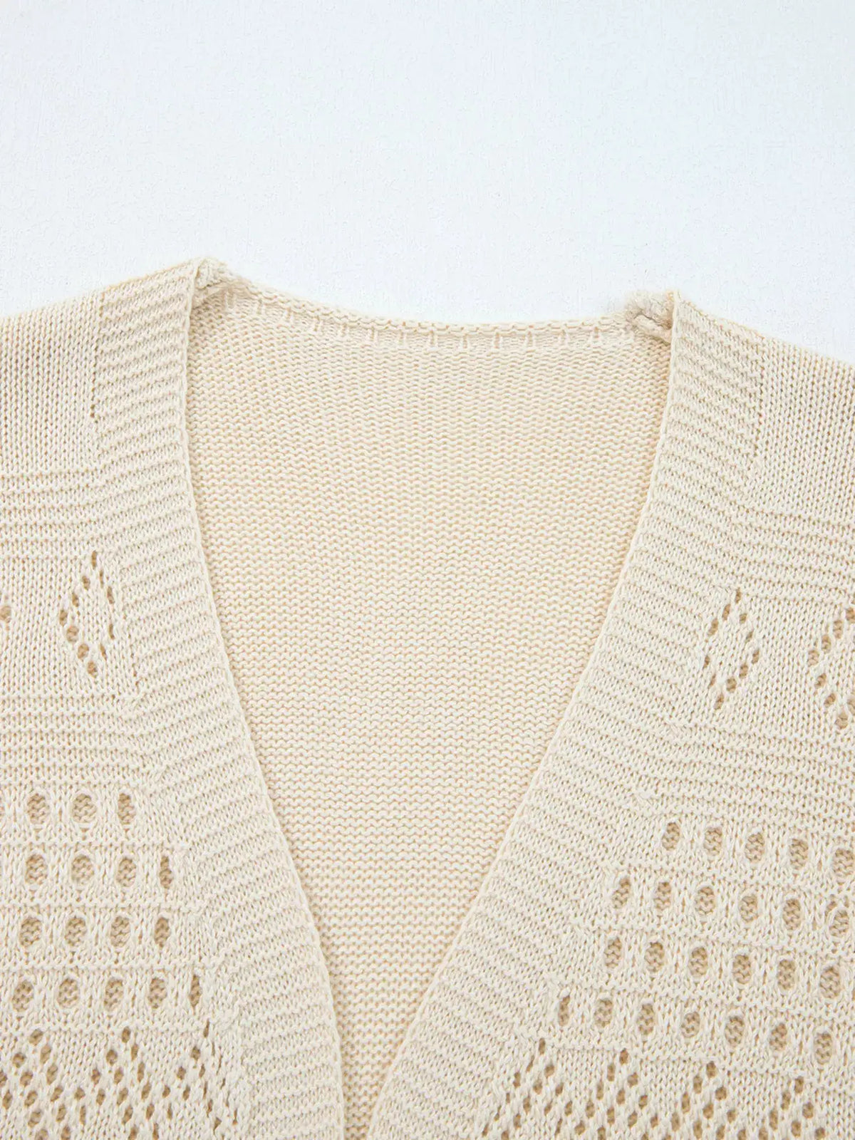 Hollowed knit open-front cardigan with side pockets in cream