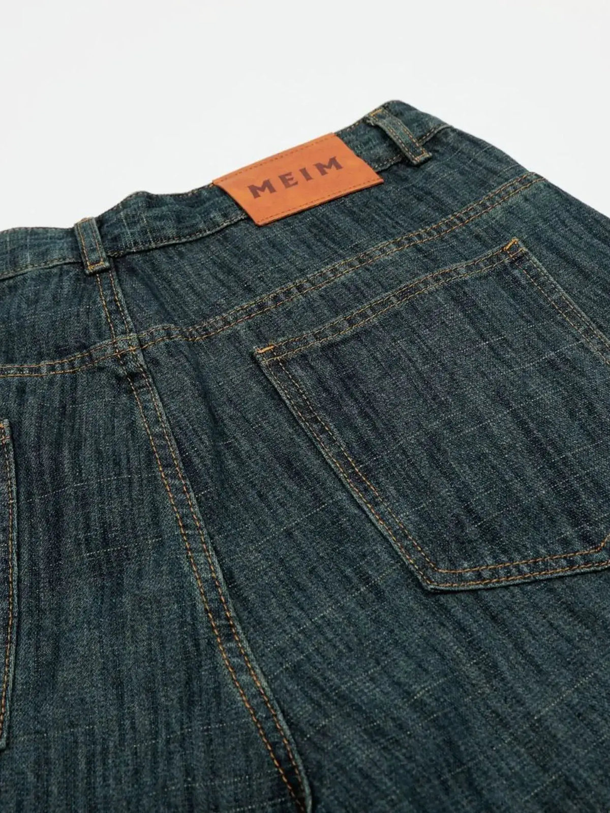 Men's relaxed-fit denim shorts, dark indigo cotton blend with MEIM label patch