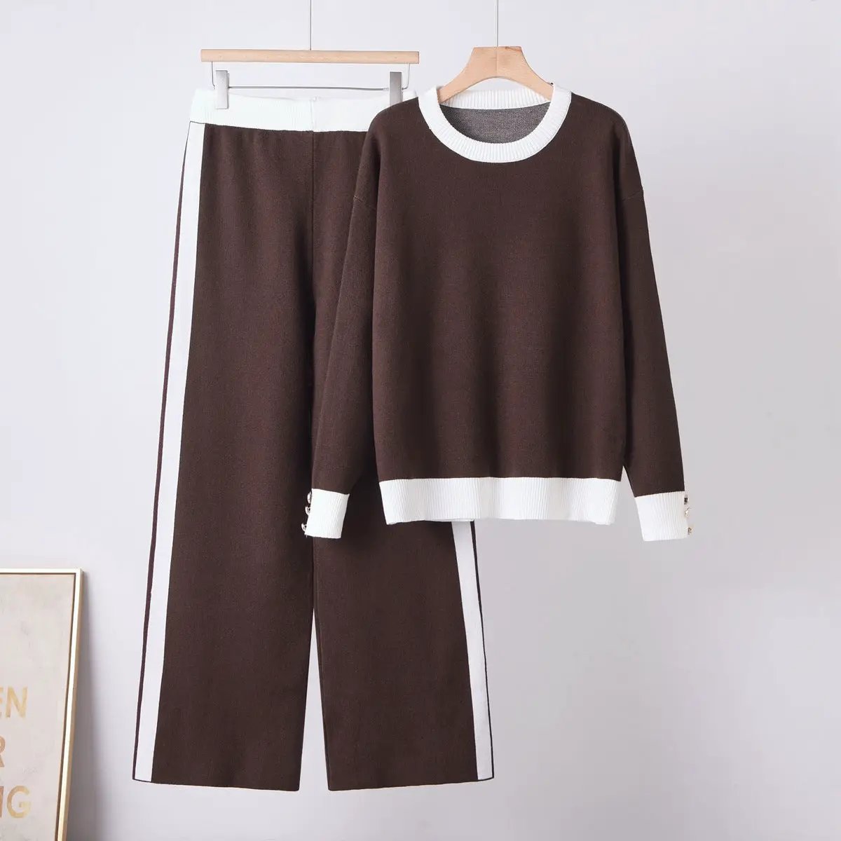 Women's knit sweater and wide-leg pants set by eprolo, brown with white cuffs and waistband, side stripes.