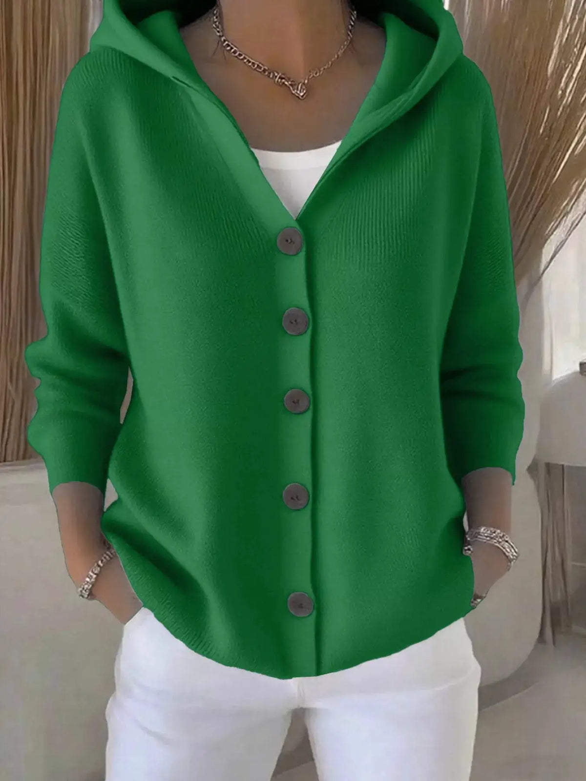 Plus-size hooded button-front soft-knit cardigan in emerald green over white top