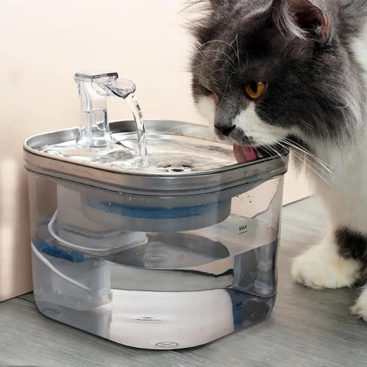 AdTec pet automatic water fountain with transparent reservoir and circulating water; cat drinking.