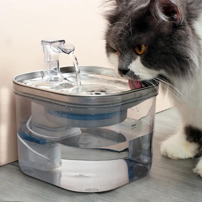 AdTec pet automatic water fountain with transparent reservoir and circulating water; cat drinking.