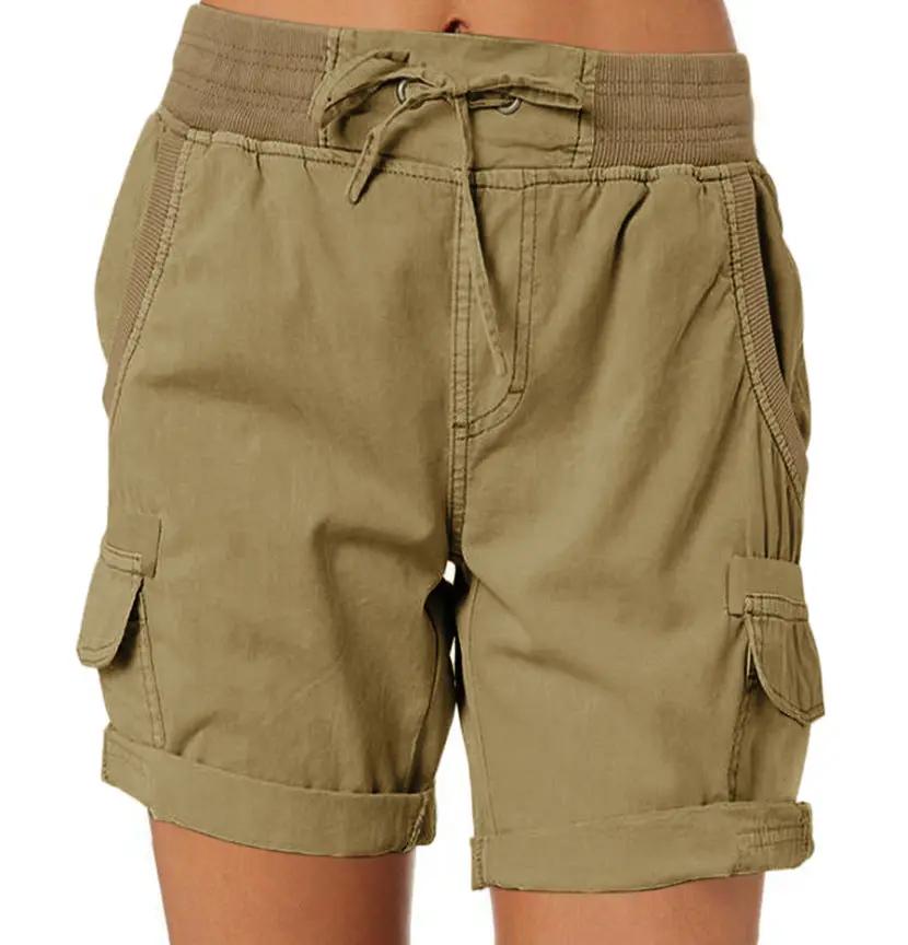 Lightweight women's cargo shorts in tan with drawstring waist, deep cargo pockets, and rolled cuffs.