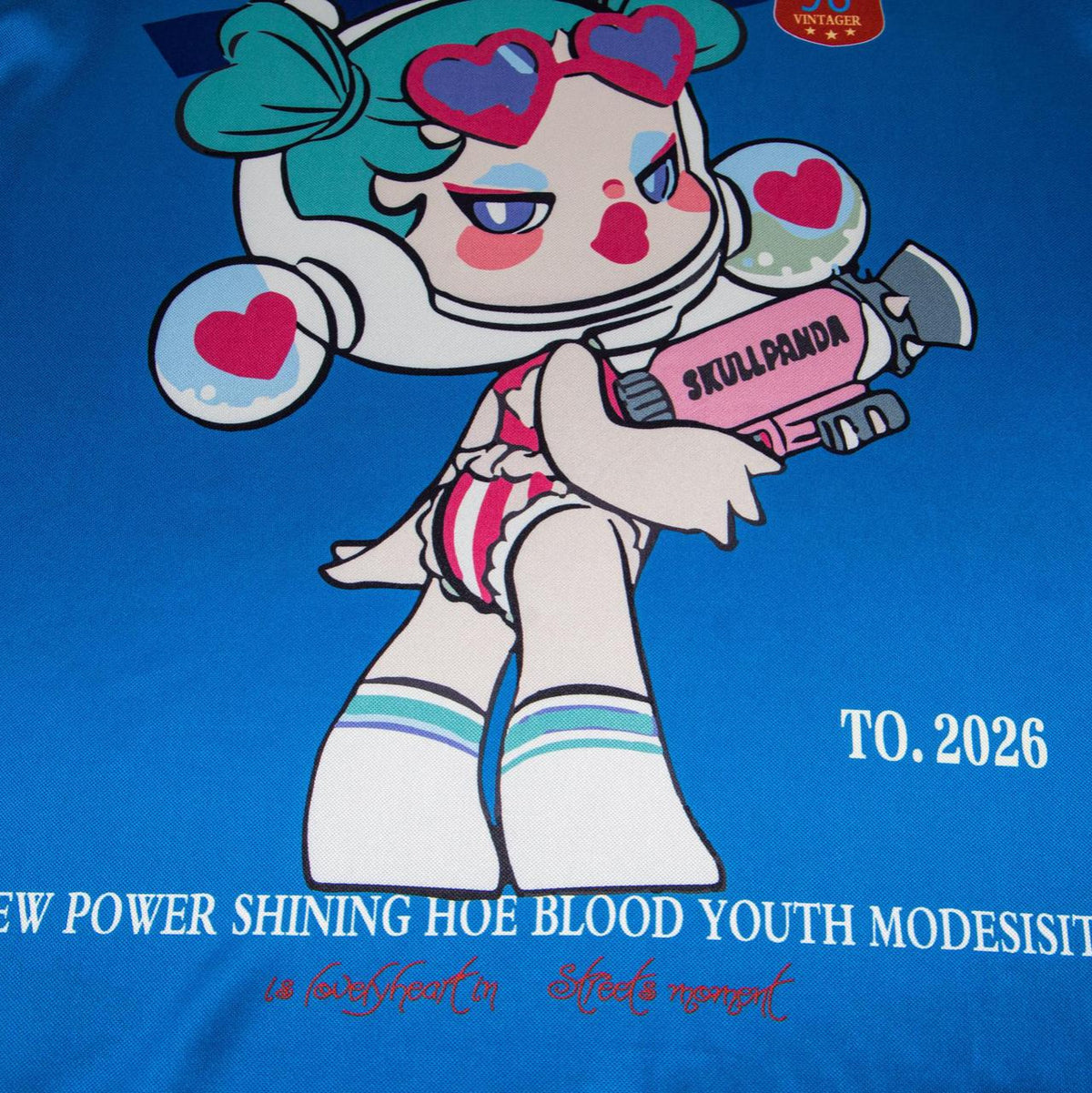 Cartoon character printed blue short-sleeve T-shirt with a pink water gun graphic
