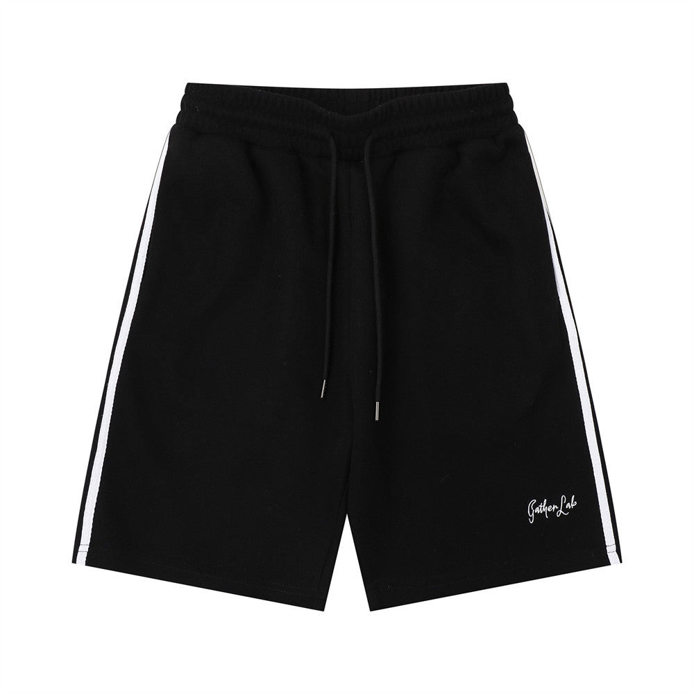 Black jogger shorts with white side stripes, elastic drawstring waist, Gather Lab logo.