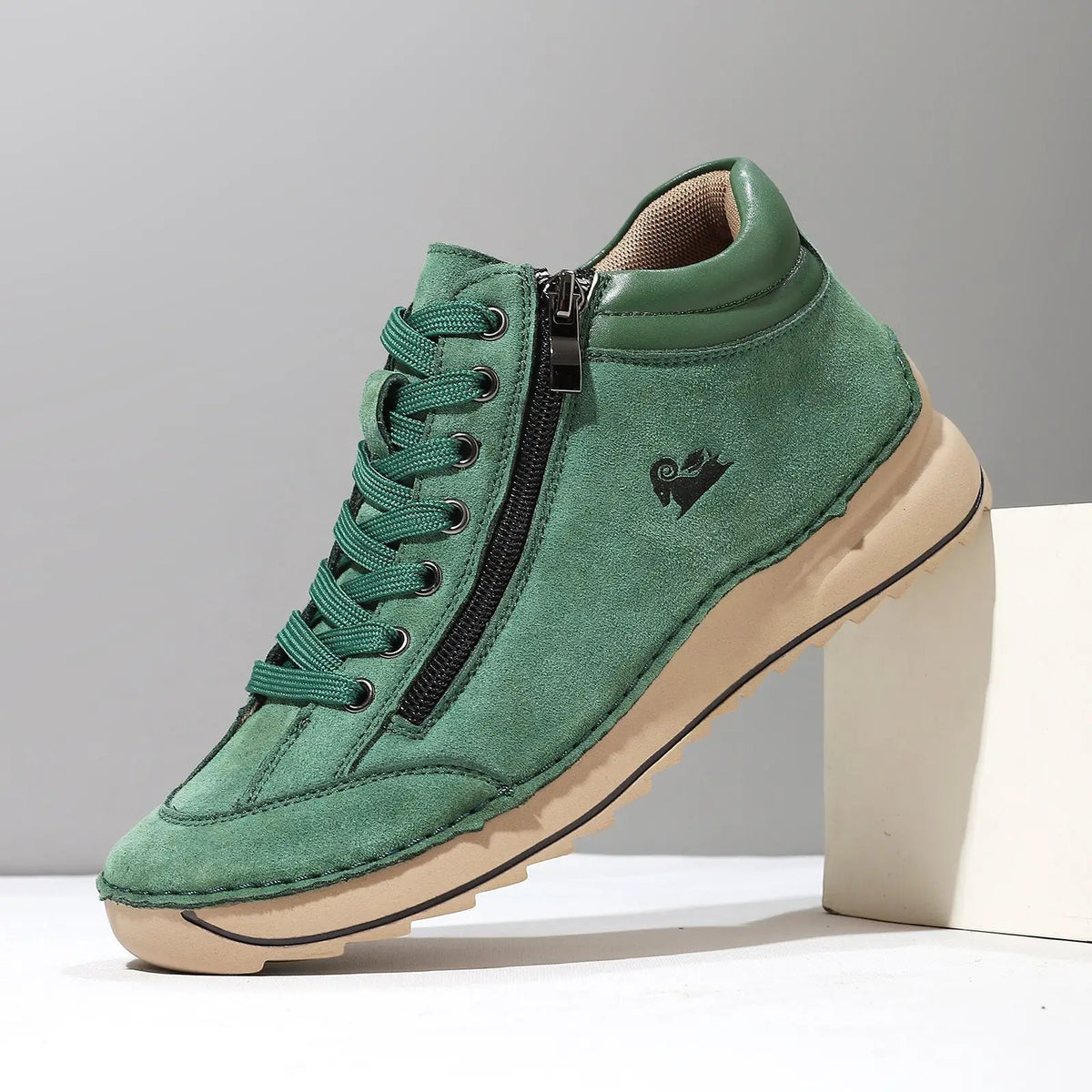Flat dress shoe for women by AdTec in green suede with lace-up front and side zipper.