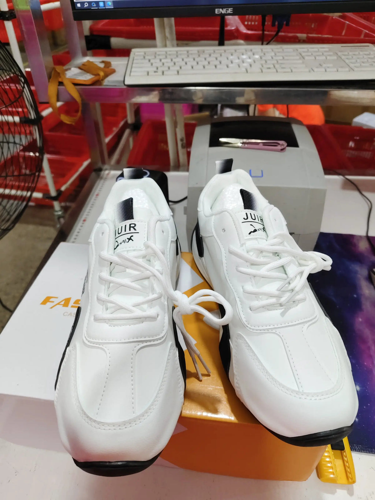 AuraStep height-boosting non-slip men's sneakers by AdTec, white with black sole.