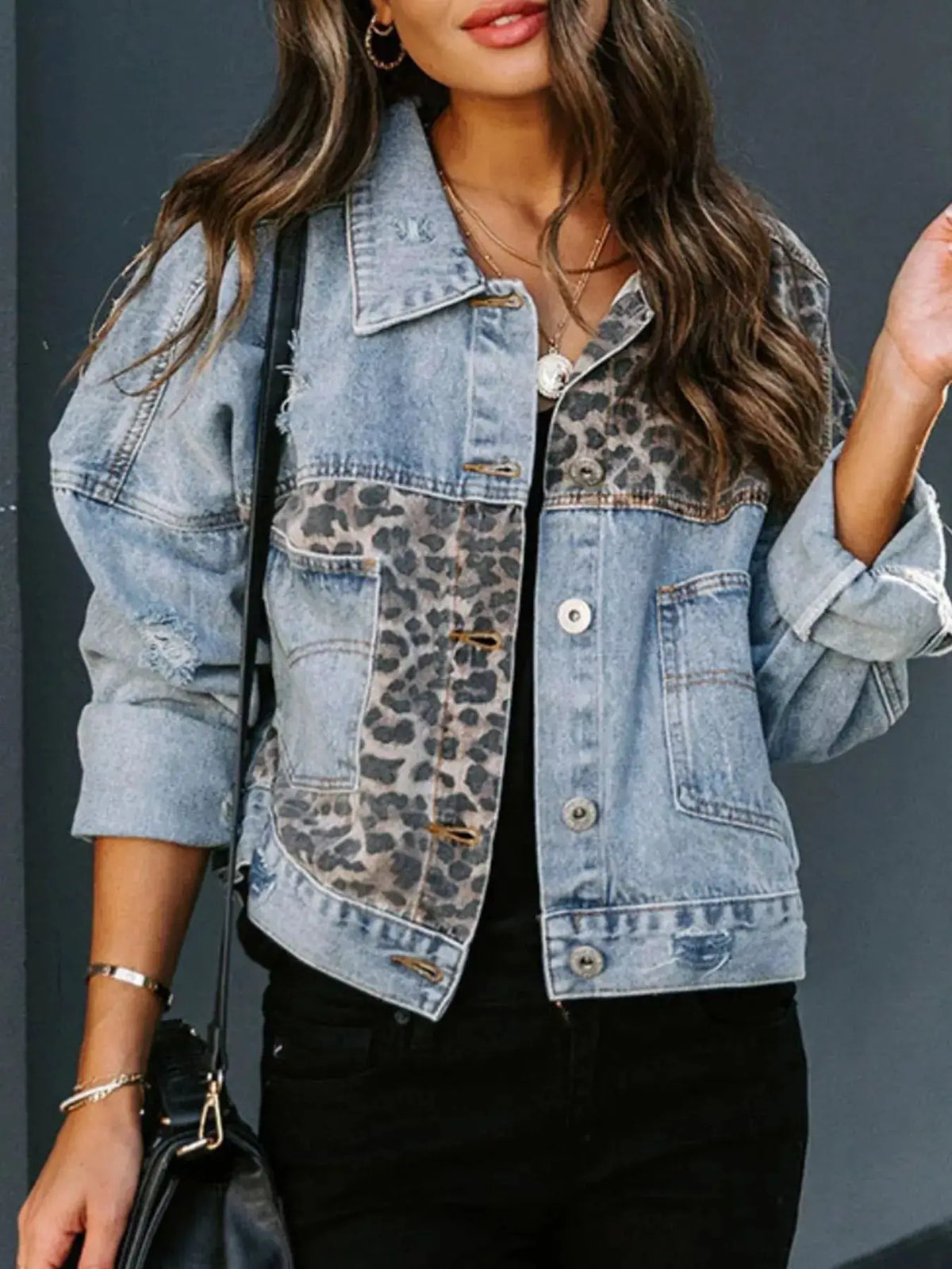 Leopard-print distressed denim jacket with button-front closure; blue casual outerwear