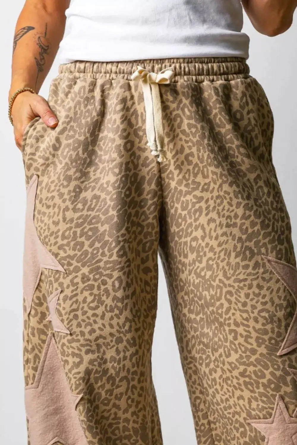 Leopard Star Patch Loose Pants by Trendsi, beige leopard print with star patches and drawstring waist.