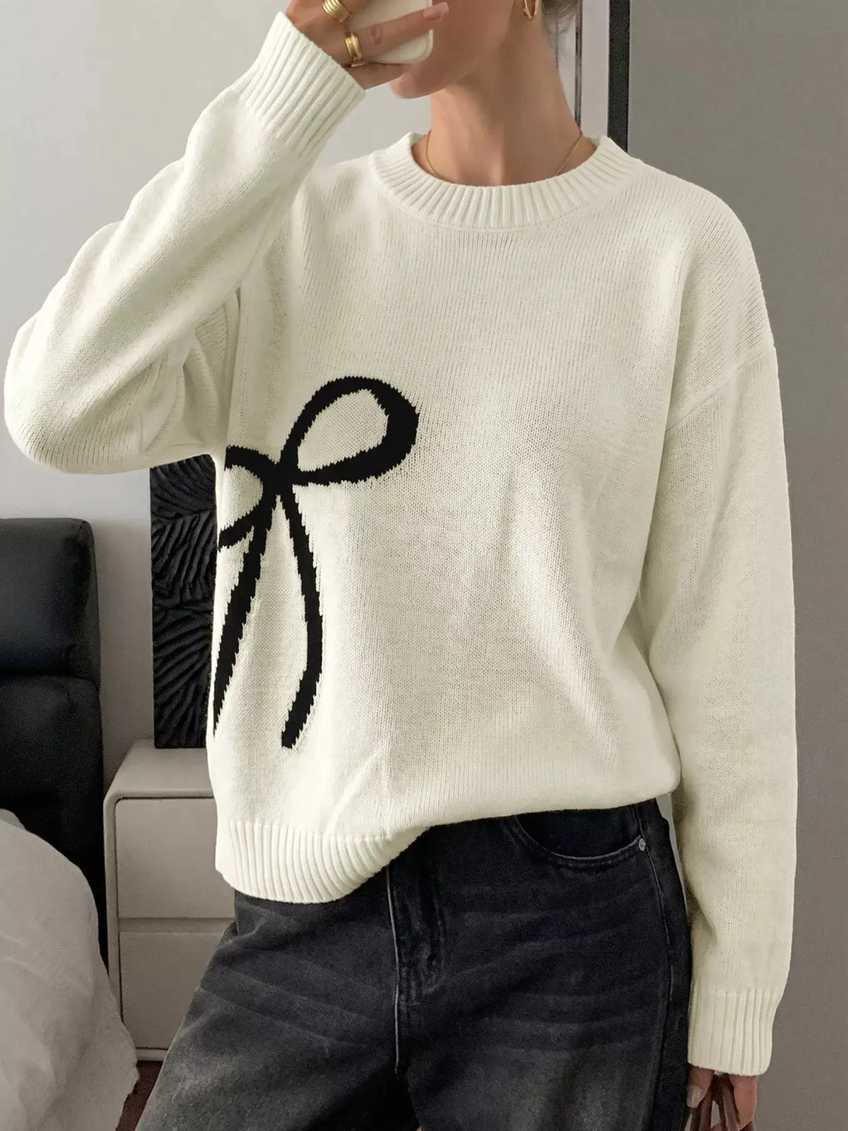 Bow graphic ivory acrylic sweater with round-neck and soft stretch fit