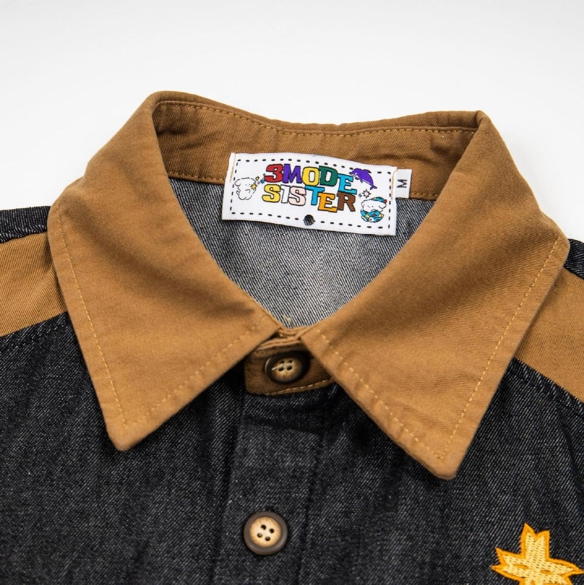 Dog embroidered denim short-sleeve shirt with tan collar and dark denim body; street-trend pet apparel.