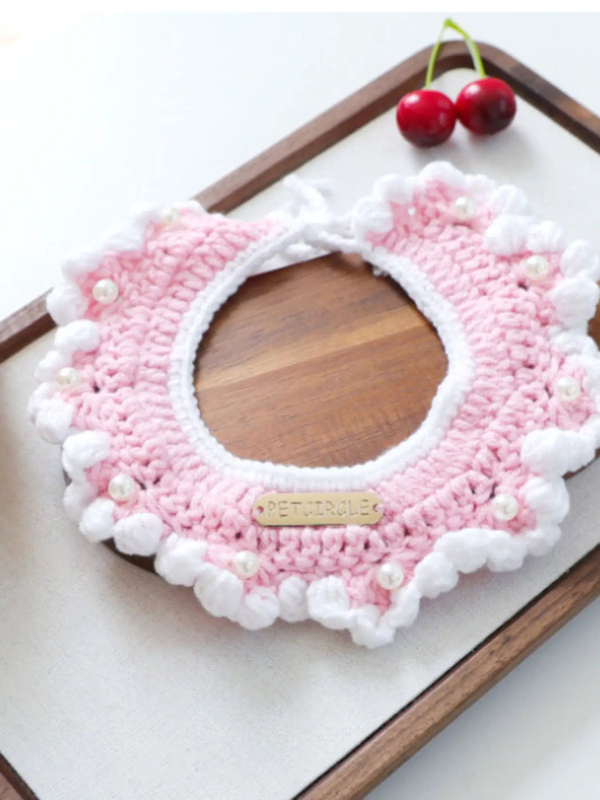 Contrast Pet Scarf, pink crochet circular dog scarf with white trim, pearl beads, PETCIRCLE label.